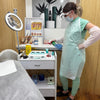 Therapist in PPE disinfecting an electrolysis treatment room - SHBBINF002 infection control training